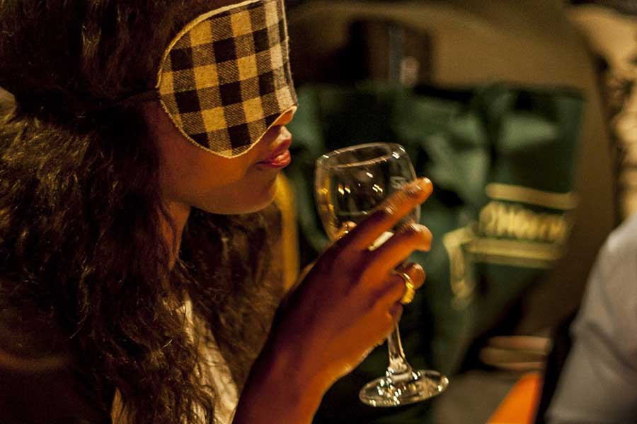 A girl is enjoying a blindfolded dinner