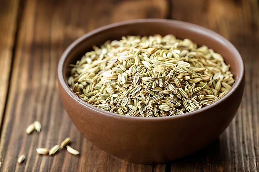Fennel seeds in the wooden bowl