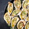 Barbecue overbaked fresh opened oyster with garlic and herbs