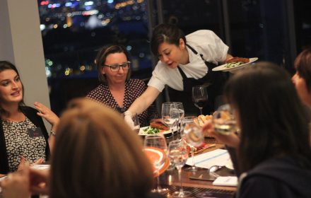 Chef Sasha serving a group of ladies