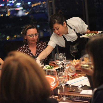 Chef Sasha serving a group of ladies