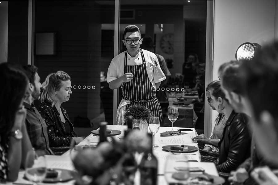 Chef Nick Guan explains his dishes to guests