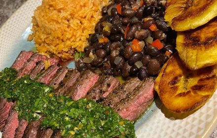 Chef Bella Rose Churrasco Steak with Homemade Chimichurri Mexican Rice and Black Beans with a side of platano dish