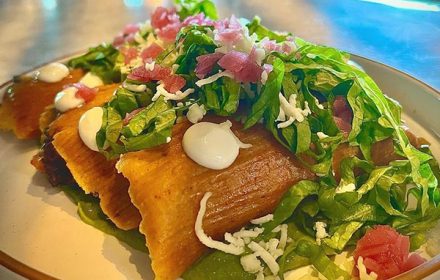 Chef Araceli Perez Refried Beans Spinach and Panela Cheese with Crema Lettuce Pickled Onions Salsa Verda and warpped in Masa Rojo Dish