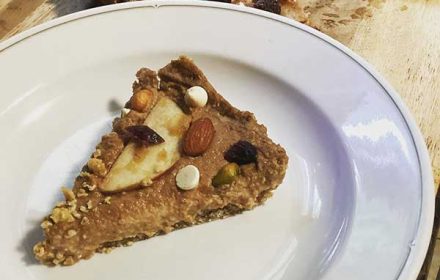 Chef Ralph Cazenave Bey Raw Apple Sunflower Butter Pie, Date Oat Crust, Mixed Nuts, Cranberries, Cocoa Butter Chips