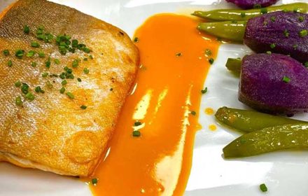 Chef Steven Queen Seared Artic Char, Duck Fat Confit Purple Potatoes, Snap Peas, Carrot Burre Blanc