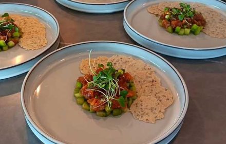 Chef Oliver King Twist on Caprese Salad with Garlic and Herb Rice Cracker, Pesto, Basil, Tomato, Pearl Mozzarella, and Feta Cheese