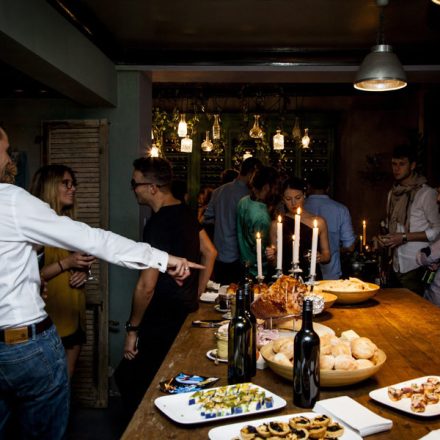 A bunch of friends enjoying an Easter feast with ham