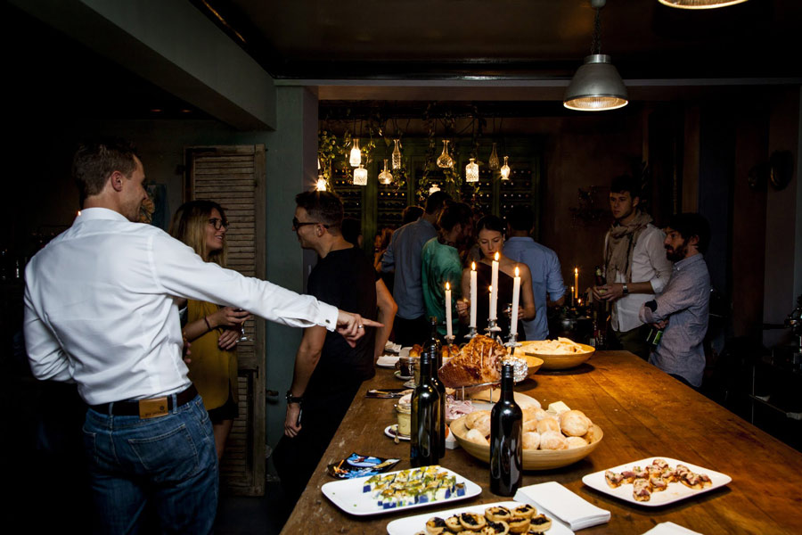 People-enjoying-an-Easter-Feast A bunch of friends enjoying an Easter feast with ham