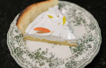 Chef Betty Coquillard burnt crust lemon meringue pie, with comestible flower petals